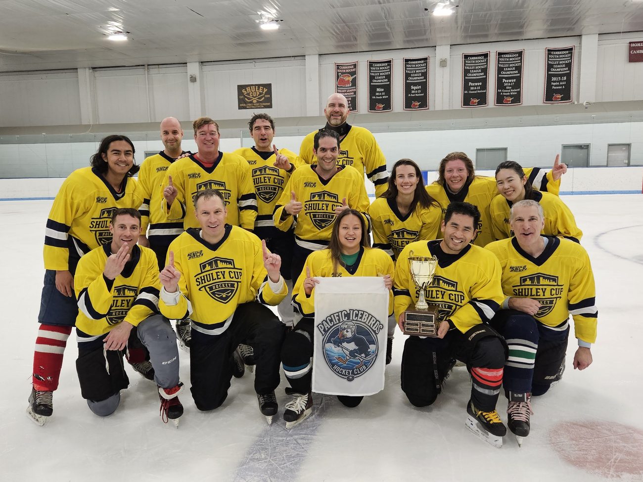 The Pacific Icebirds, 2025 Shuley Cup champions, with the trophy on the ice at Simoni Rink